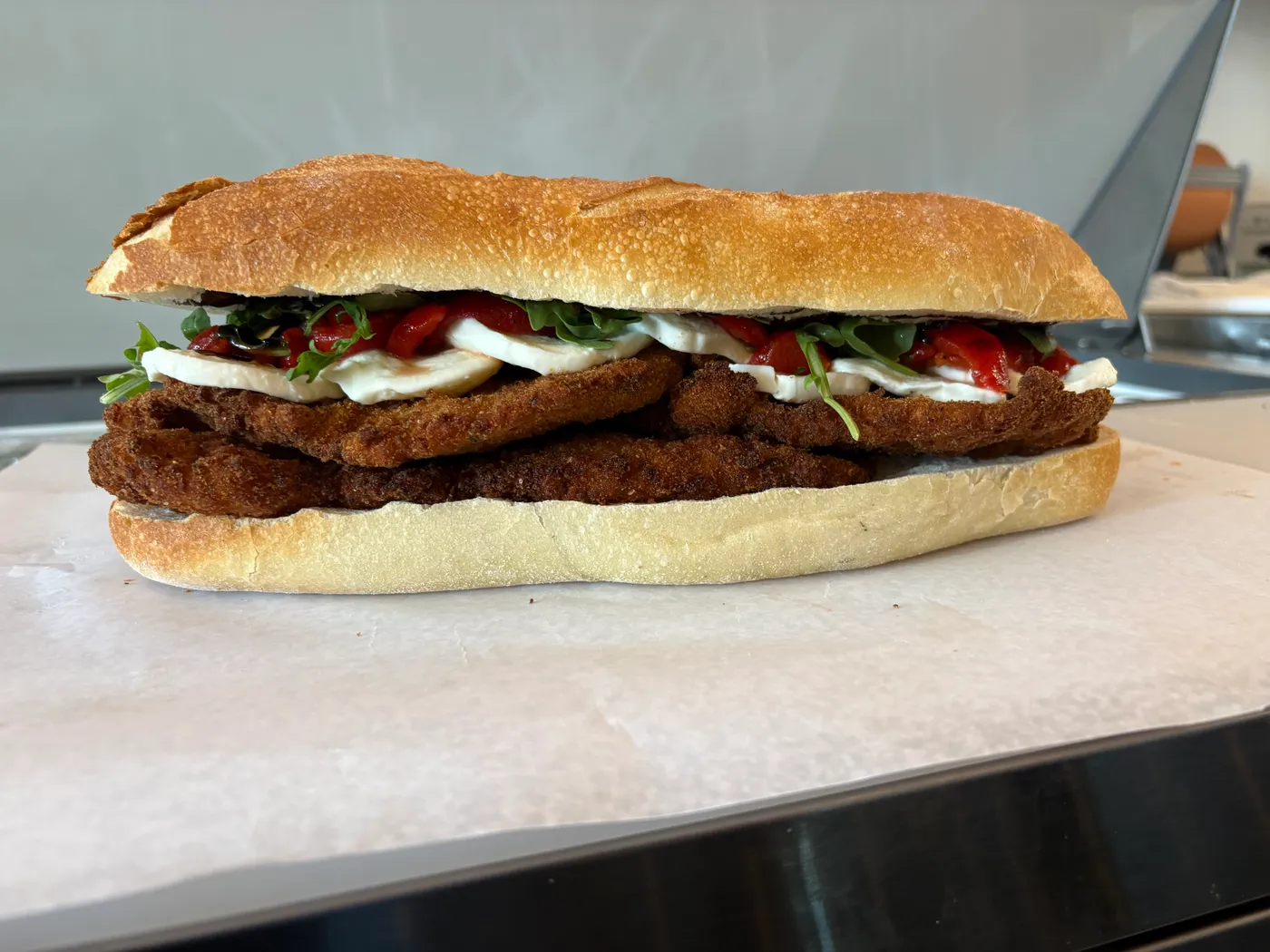 Chicken cutlet sandwich with fresh mozzarella and roasted red peppers