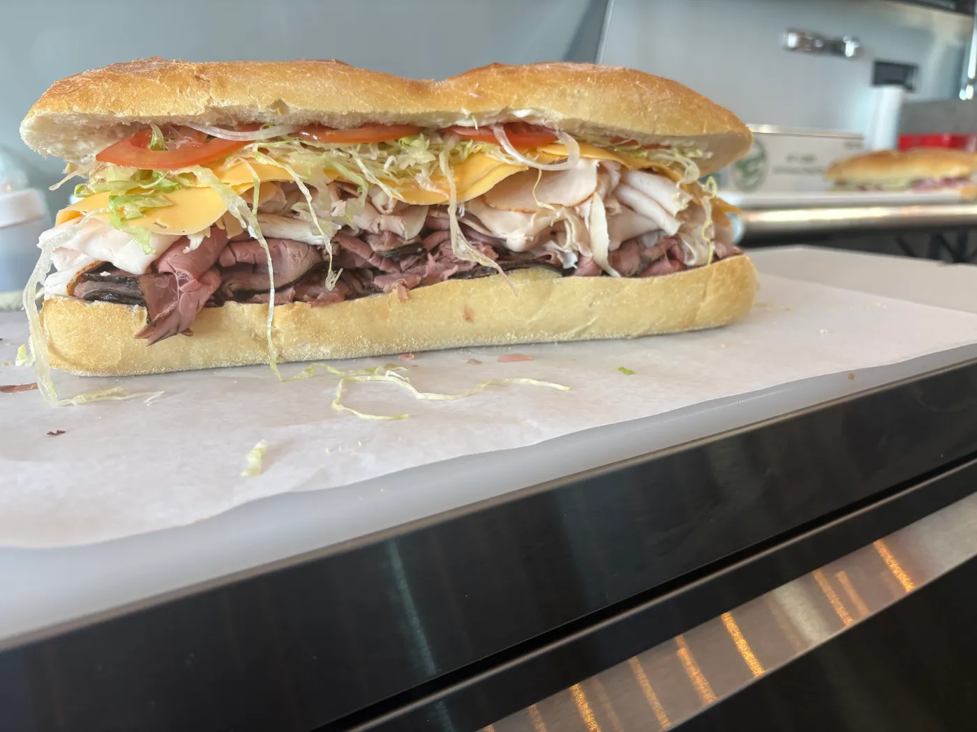 Loaded cold-cut sandwich with turkey, roast beef, and provolone