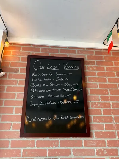 Our Local Vendors chalkboard sign inside Zio's Market