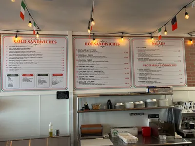 Hot and cold sandwich menu boards on the wall