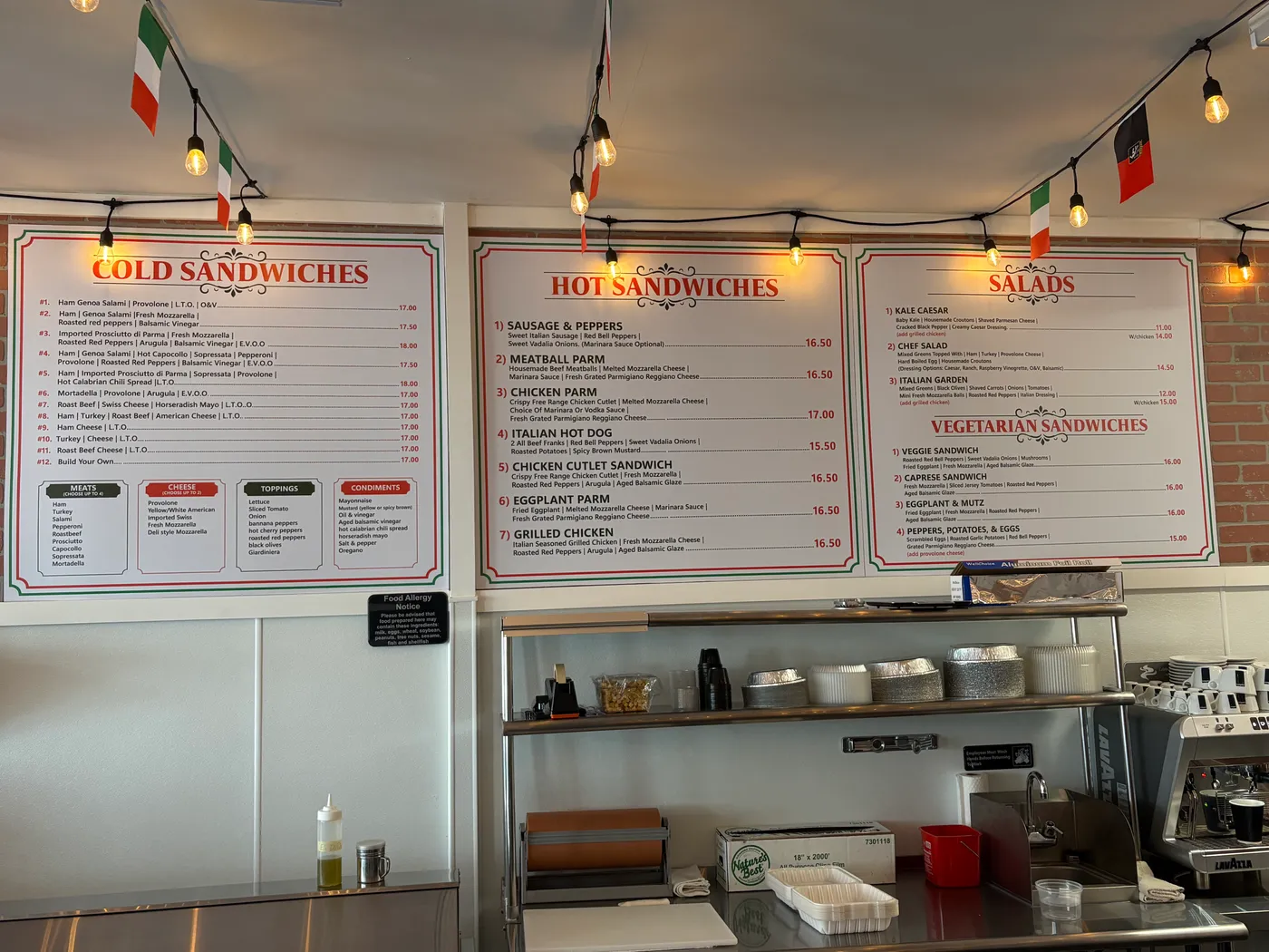 Hot and cold sandwich menu boards on the wall